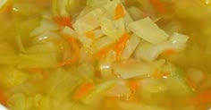 a white bowl filled with soup and vegetables