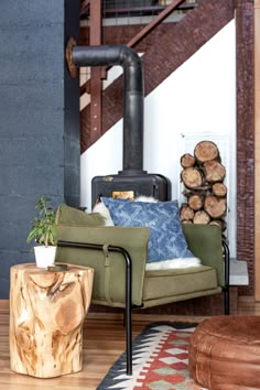 a living room filled with furniture and a wood burning stove in the backround