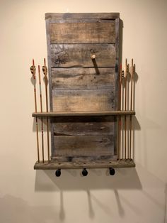 an old wooden shelf with arrows on it