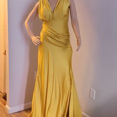 This Dress Is Not Brand New But Was Worn Once. It's In A Very Good Condition , It Stretches Fitted Yellow Satin Evening Dress, Formal Ruched Evening Dress, Yellow Satin Party Gown, Yellow Satin Gown For Party, Silk Ruched Maxi Dress For Party, Silk V-neck Gown For Party, Yellow Fitted Pre-draped Dress, Ruched A-line Evening Dress For Party, Yellow Fitted Gown For Formal Occasions