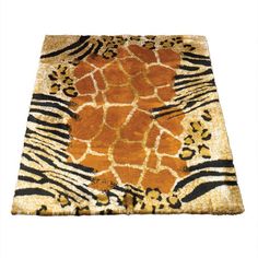 an animal print area rug with orange and black stripes on the bottom, in front of a white background