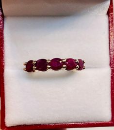 Absolutely Stunning Vintage 14k Yellow Gold Natural Rubies  band Ring 100%  Natural Rubies  Beautiful genuine Ruby 6x4 mm each 5 Rubies                                       2.25 CTW Clarity:                                              VS2 Total ring weight:                        4.1 GR 14K Yellow Gold Ring sizing available Free of Charge For more information regarding this item feel free to reach me so I can accommodate your needs.  Thank you Oval 14k Gold Eternity Band, Elegant Oval Ruby Stackable Ring, Fine Jewelry Oval Stackable Rings With Prong Setting, Fine Jewelry Oval Stackable Rings For Anniversary, Oval Stackable Fine Jewelry Rings For Anniversary, Oval Stackable Rings For Anniversary, Classic Oval Stackable Ruby Ring, Fine Jewelry Stackable Oval Ruby Ring, Classic Oval Ruby Ring Stackable