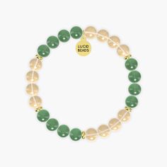 This bracelet named Success Manifestation combines the vibrant energy of Citrine with the soothing properties of Aventurine. Citrine, known as the 'merchant's stone', is associated with success, prosperity, and abundance. Its sunny yellow color promotes positivity and motivation, helping to manifest goals and dreams. Aventurine, with its calming green hues, is believed to attract luck and opportunities while enhancing creativity and confidence. Together, these gemstones create a harmonious blend Gold Agate Crystal Bracelet For Healing, Spiritual Gold Jade Beaded Bracelets, Gold Jade Beaded Bracelets For Spiritual Purposes, Gold Jade Beaded Bracelets For Spiritual Wear, Gold Jade Crystal Bracelet With Natural Stones, Gold Jade Beaded Bracelets With Natural Stones, Gold Beaded Bracelets With Jade Natural Stones, Spiritual Citrine Beaded Bracelets For Healing, Spiritual Citrine Beaded Bracelets