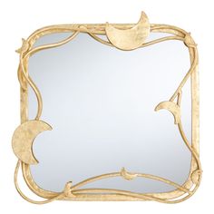 a mirror that is sitting on top of a wooden frame with vines and leaves around it