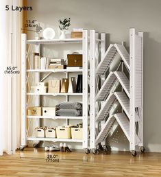 a white book shelf filled with lots of books next to a wooden floor and wall