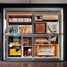 an open display case with furniture inside of it