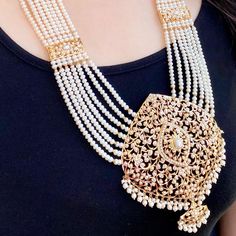 Featuring a modern pearl rani haar that speaks of magnificence and splendidness. Made in 22ct gold, this piece shows the exquisite craftsmanship. With the intricate designs and high-class materials, this Rani haar is sure to leave a lasting impression on any occasion. The haar weighs 142.82 GMs including 73.81 GMs of hanging and stringing beads. The earrings 23.09 GMs including 2.61 GMs of hanging beads. This product has been purity assayed by BIS and the unique 6 digit HUID assigned to the thre Luxury Yellow Gold Necklaces For Reception, Long Pearl Chain Necklace In Temple Jewelry Style, Temple Jewelry Long Necklace With Pearl Chain, Long Temple Jewelry Pearl Chain Necklace, Elegant 22k Gold Bridal Necklace, Elegant 22k Gold White Bridal Necklace, Elegant White 22k Gold Bridal Necklace, Festive Elegant Tilla Necklace, Luxury Gold Pearl Necklace For Wedding