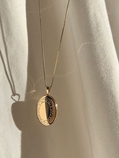 An oval locket with a floral border is placed on our 0.6mm Box Chain. Layer for effect (we recommend) or wear on its own. Always made in 100% 14k gold. Oval Locket Necklaces For Anniversary, Classic Locket Necklace For Anniversary, Classic Locket Necklace For Anniversary Gift, Elegant Medallion Locket Necklace For Anniversary, Oval Locket Necklace For Anniversary Gift, Elegant Locket Necklace For Anniversary Gift, Elegant Rose Gold Locket Necklace With Vintage Charm, Elegant Medallion Necklace For Anniversary Gift, Heirloom Locket Necklace For Anniversary Gift