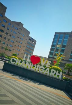 there is a large sign that says love chandigarh in front of some buildings