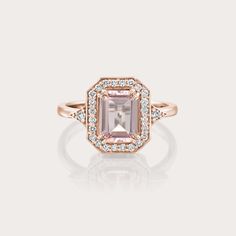 The Katerina ring is our show-stopping piece and has a large, pink Morganite stone in the center. Adorning the stone are 26 sparkling diamonds creating a halo effect around the stone. It’s a ring inspired by royalty and it's absolutely glamorous. **Due to the nature of the stone the color of the center stone may vary** All features can be customized! please contact us if you wish to make changes, we love making custom designs. All of our jewelry is carefully handmade in our atelier *HC diamond a Pink Diamond Ring With Emerald Cut And Halo Setting, Pink Emerald-cut Diamond Ring With Halo Setting, Pink Emerald Cut Diamond Ring With Halo Setting, Luxury Morganite Diamond Ring With Halo Setting, Morganite Diamond Ring With Accent Stones, Emerald Cut Diamond Cluster Ring With Halo, Fine Jewelry Emerald Cut Cluster Ring With Halo, Octagon Diamond Ring With Center Stone, Timeless Emerald Cut Halo Diamond Ring