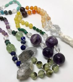 Is it a chakra mala? Is it a pride mala? Is it just a bunch of pretty gems from mama nature? You decide. This mala necklace has all the colors of the rainbow and balancing energy for the whole chakra system. It absolutely has 108 beads, so you could use for meditation, but it's important to note that they're all different shapes and sizes, so that may or may not be a concern for you. Also, there's a section of tiny little turquoise guys that are in pairs, so it would take a little extra concentr Spiritual Beaded Crystals For Meditation, Spiritual Beaded Necklaces With Gemstone Beads For Rituals, Spiritual Gemstone Beads Necklace For Rituals, Spiritual Crystal Necklaces With Round Beads, Bohemian Hand-strung Round Bead Crystals, Spiritual Round Beads Crystals For Jewelry Making, Handmade Spiritual Crystal Necklaces With Round Beads, Multicolor Beaded Spiritual Crystals, Handmade Spiritual Crystals For Meditation