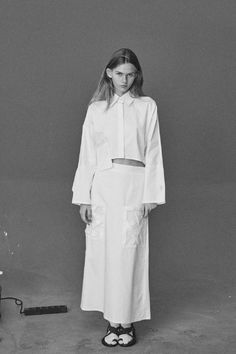 Crafted from a tough white cotton, this mid-rise skirt is complemented by a wooden black criss cross buttons on the back and two precise pleats and features big handmade pockets in front.Pair with the collection's Nizhyn White Ceramic Buttons Cropped shirt and play with proportions.Composition 100% pure cottonButtons: 100% woodDry clean onlyHandmade by women for womenSizes S (European 36)Bust: fits bust around 85 -89 cmWaist: fits waist around 68- 73 cmHips: fits hips around 92-95 cmFor overall Cross Ceramic, Ceramic Buttons, Handmade Buttons, Button Skirt, Ceramic Handmade, Cropped Shirt, Shell Buttons, Wooden Buttons, Women Helping Women