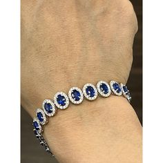 This stunning bracelet features 12.40 carats of oval blue Ceylon sapphires set in platinum. It is accented with 3.89 carats of round white diamonds, graded E color and VS1 clarity. This modern piece was crafted in the United States by skilled artisans. The sapphires are beautifully matched, and the diamonds sparkle with exceptional brilliance. This bracelet is sure to become a treasured heirloom. Luxury Oval Sapphire Bracelets, Blue Oval Sapphire Diamond Bracelet, Luxury Sapphire Bracelets With Diamond Accents, Luxury Sapphire Bracelet With Diamond Accents, Luxury Sapphire Diamond Bracelet, Brilliant Cut, 16 29, Ceylon Sapphire, Sapphire Diamond, White Diamonds