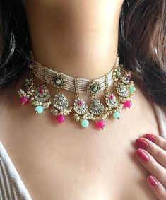 Adorn yourself in timeless elegance with this exquisite Light blue and rani pink Kundan necklace set, perfect for weddings and special occasions. Crafted with meticulous attention to detail, the set features delicate pink and golden hues reminiscent of Pakistani and Punjabi traditions, with a touch of Bollywood glamour. Complete with matching earrings and a stunning maangtika, this Indian Kundan ensemble effortlessly captures the essence of sophistication and grace. Measurements:  Necklace weigh Festive Pink Jeweled Jewelry, Bollywood Style Jeweled Jewelry For Diwali, Pink Tilla Jewelry For Party, Pink Jewelry For Wedding And Diwali, Pink Kundan Jewelry With Tilla, Bollywood Style Pink Jewelry With Stone Work, White Jeweled Bollywood Jewelry, Pink Wedding Choker Jewelry, Pink Kundan Jewelry For Festivals