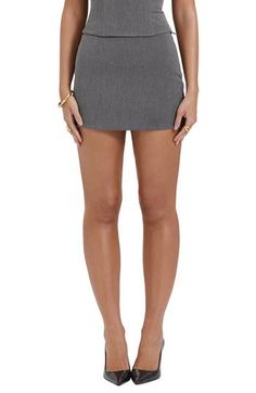 With a short length and a strikingly simple silhouette, this miniskirt expertly balances classy polish with showy intrigue. Exclusive retailer Lined 63% polyester, 33% viscose, 4% elastane Dry clean Imported Modern Mini Length Bottoms For Party, Modern Mini Length Party Bottoms, Chic Fitted Mini Skort, Relaxed Mini Skort, Lined Mini Length Skort, Chic Fitted Denim Mini Skirt, Summer Office Mini Skort, Summer Mini Length Pencil Skirt For Work, Fitted Pleated Mini Skirt