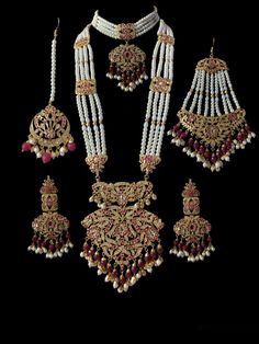 Ready to ship bridal set includes choker , earrings , jhoomar , tika , ring , bracelet and Rani haar made using cz stones , shell pearls , beads and gold plating Hand Set Ruby Bridal Sets For Wedding, Hand-set Kundan Necklace For Marriage, Pearl Jewelry With Stone Work For Wedding, Bollywood Style Pearl Sets With Stone Work, Hand Set Kundan Necklace For Marriage, Wedding Pearl Jewelry With Stone Work, Kundan Pearl Drop Jewelry For Wedding, Wedding Kundan Jewelry Sets With Pearl Drop, Pearl Chandbali Wedding Jewelry