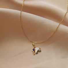 14K Real Gold Necklace Dark Blue White Enamel Elephant Pendant Handmade Minimalist Animal Design Dainty Christmas Elegance Gift for Women ⓂMaterials & Specifications : Necklace Chain Lengths : 42 cm (16.5 in) 44 cm (17.3 in) 46 cm (18.1 in) 48 cm (18.8 in) Elephant Pendant Width : 1.1 cm (0.43 in) Elephant Pendant Length : 0.9 cm (0.35 in) Handmade Item Special Design Elegant Blue Gold-plated Charm Necklace, Elephant Necklace Gold, Real Gold Necklace, Tiny Elephant, Beautiful Gold Necklaces, Gold Elephant, Elephant Necklace, Elephant Pendant, Necklace Chain Lengths