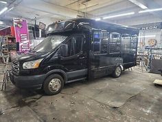 a black van is parked in a garage