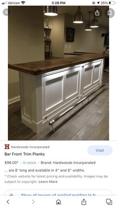 an image of a kitchen island made out of wood and white cabinets with built - in lighting