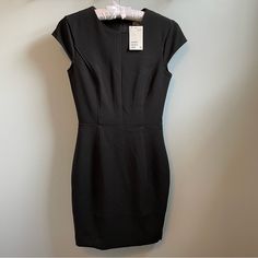 Classic Little Black Sheath Dress By H&M Lined Piping Detail Size 2 French Girl Style Great Addition To A Capsule Wardrobe Cocktail Dress Business Office Attire Lbd Approximately Length 35.5” Waist 12.75” Stretch Lined Dresses For Work, Classic Black Bodycon Dresses, Classic Black Sheath Bodycon Dress, Black Career Dresses, Fitted Sheath Mini Dress For Work, Short Sleeve Lined Mini Dress For Work, Lined Short Sleeve Mini Dress For Work, Black Sheath Bodycon Dress For Work, Black Short Sleeve Career Dress