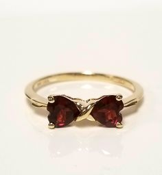 "Thanks for shopping our vintage estate store. We tend to sell well below wholesale and truly hope you enjoy all of our items. Many of the items are one of a kind, so please enjoy scrolling through the pictures and hopefully something will catch your eye. Brown spots are from reflections. Estate 14k yellow gold natural heart .50ct garnet midi or birthstone bypass ring. Ring size: 7 Setting: 5mm 1/4\" by 1/2\" Band width: 1.5mm Weight: 1.66 grams Beautiful ring. Marked 14k." Heirloom Ruby Ring For Valentine's Day, Formal Heart Cut Ruby Ring In Yellow Gold, Heirloom Rings For Valentine's Day Formal Occasions, Formal Gold Ruby Ring With Heart Cut, Formal Heart Cut Rings Stamped 14k, Valentine's Day 14k Heart Ring For Anniversary, Classic Heart-shaped Ruby Ring For Formal Occasions, Classic Solitaire Jewelry For Valentine's Day, Formal Rings With Birthstone For Valentine's Day