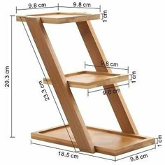 a wooden shelf with two shelves on each side and measurements for the bottom half of it