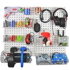 a peg board with various items on it and a video game controller in the middle