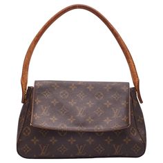 This Louis Vuitton Looping Bag is made with brown canvas with monogram print. The bag feature vachetta leather trim, gold toned hardware, a looping rolled leather top handle, a front flap with magnetic snap closure and a brown woven fabric interior lining with a single interior zip pocket. Vintage. Color: Brown monogram print Material: Coated canvas with vachetta leather details Date code: MI0072 Year: 2002 Made in France Size PM Measurements~ Height 7” Width 11” Depth 3.5” Shoulder strap drop: Lv Shoulder Bag Outfit, Vintage Louis Vuitton Bag, Louis Vuitton Vintage Bag, Cole Palmer, Shoulder Bag Outfit, Lv Shoulder Bag, Sac Louis Vuitton, Louis Vuitton Vintage, Handbag Collection