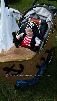 a baby in a pirate boat costume