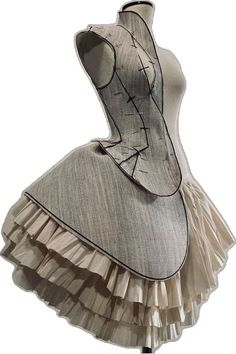 a mannequin wearing a dress with ruffles on it's skirt