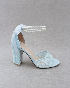 Fun and flirty block heel sandals in crochet lace with double pearl ankle straps. Elegance and classic inspired wear for your special day.DETAILS:HEELS: 3.75 inchesCOLORS AVAILABLE: Ivory, White and Light BlueUPPER: Synthetic upper and liningMATERIALS: Manmade outsoleORIGIN: ImportedSTYLE NAME: FAITH