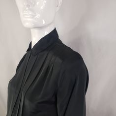 "by Kristin, black blouse with hidden buttons panel and front pleats. Fits Medium 19\" across 23\" long 23\" sleeves * Please review all shop policies before completing transaction. All sales final. No returns or exchanges. * Bundle up for combined shipping. * Instagram @vintagerunsdeepshop" Long Sleeve Pleated Shirt For Work, Pleated Long Sleeve Shirt For Work, Black Long Sleeve Top For Semi-formal Occasions, Elegant Pleated Evening Blouse, Elegant Pleated Blouse For Evening, Spring Black Blouse With Pleated Sleeves, Fitted Black Pleated Tops, Fitted Pleated Tops For Work, Black Blouse With Pleated Sleeves For Spring