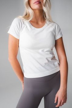 Our Energy Tee is designed for high performance activities as well as for on the go. This seamless short sleeved tee is fitted yet flexible and hits at the top of the waistband. High Stretch Go-dry Crew Neck T-shirt, Short Sleeve T-shirt For Workout, Basic Go-dry T-shirt For Workout, Seamless Short Sleeve T-shirt For Gym, Athleisure Compression Crew Neck T-shirt, Breathable Short Sleeve T-shirt For Light Exercise, Fitted Crew Neck Workout T-shirt, Fitted Crew Neck T-shirt For Workout, Functional Breathable T-shirt For Light Exercise