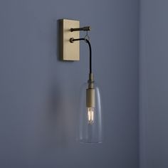 a light that is on the wall next to a blue wall with a black handle