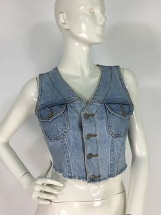 "1990s bongo 100% cotton Jean crop top, size 7, made in USA  mannequin measures 5ft 8\", bust 34\", waist 25\", hip 33\" Measurements:  bust 16\"/length 15\" Please note that vintage clothing sizes can vary greatly.  The Measurements provided are taken with garment lying flat.  I suggest taking a similar garment from your wardrobe and measure it while lying flat.  This way you can compare measurements.   Please note buyer is responsible for any duties, taxes or customs clearance fees imposed by their country. Be sure to check in often as new gems are added daily.. **all sales are final." Cropped Denim Blue Denim Jacket For Summer, Cropped Denim Blue Jacket For Summer, Summer Cropped Denim Blue Jacket, Cropped Dark Wash Denim Jacket For Summer, Cropped Cotton Denim Jacket For Summer, Summer Cropped Cotton Denim Jacket, Cropped Denim Jacket For Summer, Spring Cropped Cotton Denim Top, Dark Wash Denim Crop Top