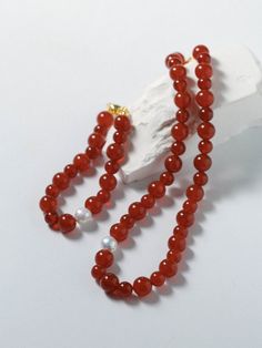 Enhance your style with our stunning Natural Red Agate Necklace and Bracelet set, symbolizing the vibrant energy of the New Year with hues of luck and prosperity. Perfect for the Lunar New Year, these unique pieces feature natural agate beads in shades ranging from translucent tomato red to rich cherry red. Pairing elegance with sophistication, this set is a must-have for the upcoming celebrations. Metal: 18K Recycled Gold Plated On Brass Gemstone: Red Agate/Freshwater Baroque Pearl Pearl/Agate Red Agate Necklace, Agate Stone Necklace, Necklace And Bracelet Set, Gemstone Beaded Necklace, Onyx Necklace, Necklace And Bracelet, Agate Necklace, Red Agate, Lunar New Year