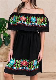 Traditional Black Dress With Floral Print, Traditional Black Floral Print Dress, Traditional Black Spring Dresses, Black Dress With Geometric Embroidery For Spring, Black Dress With Embroidered Hem For Vacation, Black Peasant Dress For Spring, Black Folk Style Beach Dress, Black Folk Embroidered Summer Dress, Black Floral Embroidered Dress For Festival