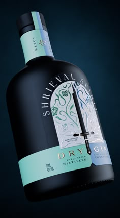 a bottle of dry gin on a black background with a green stripe around the neck