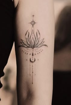 a woman's arm with a flower tattoo on the left side of her arm