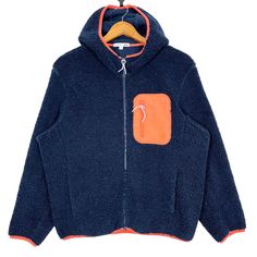 Uniqlo JW Anderson Zipper Hoodie Fleece Jacket Size Medium * Made in : China * Size on Tag : M * Manual Measurement (inch) : Chest 23.5, Length 25, Shoulder 18.5, Sleeve 22, Hem 18. * Recommended for Size : Medium (M) * Material : Polyester  * Colour : Navy Blue with Orange stripes  * Condition : Good * See photos for details. * Free Defect : No Stain, No Holes, No Tears, No Faded. 6515 Winter Fleece Windbreaker With Drawstring Hood, Navy Hoodie For Outdoor Fall Activities, Long Sleeve Fleece Jacket With Kangaroo Pocket For Outdoor, Cold Weather Fleece Windbreaker With Fleece Lining, Long Sleeve Fleece Jacket With Pocket For Outdoor Activities, Navy Hooded Hoodie For Winter, Navy Winter Hoodie, Sporty Hooded Fleece Jacket With Fleece Lining, Sporty Hooded Fleece Jacket With Lining