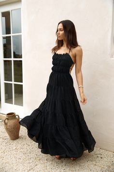 Step into timeless elegance with our Renaissance Art Maxi Dress in Black. Whether you're attending a garden wedding or exploring historic landmarks. this dress exudes sophistication and grace. Style with black heels and gold adornments to elevate the look. Maxi dress. true to size Adjustable back strap Tie back details Exposed back Flowy skirt Semi-elasticated bust and waist Lined 100% Polyester Non-stretch material Please refer to the care label on garment for specific instructions on how to care for it Model wears XS Length from shoulder to hem: 127cm on an S Chest 30cm. Waist 27cm. size S Flowy Dress Casual, Black Flowy Dress, Spring Break Dress, Historic Landmarks, Long Fitted Dresses, Cocktail Dress Formal, Crop Dress, Off Shoulder Dresses, Skirt And Top Set