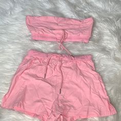 Nwot Two Piece Set. Light Pink Color. Top Is Bandeau Style With Tight Bottom And Tied For Adjustment. Size Small. Imo I Would Say It’s A True Small. Just Wrinkled From Being In The Plastic Bag For So Long. Never Even Used. Fitted Pink Short Top, Summer Fitted Crop Top For Loungewear, Pink Short Crop Top For Summer, Fitted Summer Crop Top For Loungewear, Trendy Cotton Crop Top With Drawstring, Fitted Summer Crop Top With Drawstring, Casual Fitted Crop Top With Drawstring, Short Spring Tops With Drawstring, Fitted Pink Tops With Drawstring