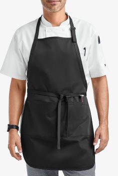 a man wearing an apron and white shirt