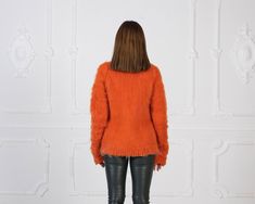 "MATERIAL : 2 strands Extra Fine Merino wool COLOUR : Orange ( There may be a slight difference because of the different monitors' representation) ♥ In the picture the model is wearing a garment with these measurements : A: ( Body lenght) : 26 \" / 66 cm B: ( Chest width) : 17.3 \" / 44 cm C: (Sleeve from under the arm) : 22.4 \" / 57 cm D: (Neck unrolled) : 12.6 / 32 cm. They are taken with the item laid flat and not streched. ♥ For choosing your size please look at size chart in our listing pi Fine Knit Mohair Sweater For Fall, Mohair Long Sleeve Sweater For Fall, Winter Fine Knit Mohair Tops, Fine Knit Mohair Tops For Fall, Long Sleeve Mohair Top For Fall, Fitted Mohair Sweater For Fall, Fitted Mohair Sweater For Layering, Turtleneck Women, Minimalist Clothing