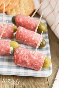 small appetizers with pickles and crackers on a plate