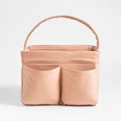 a pink purse with two pockets on the inside