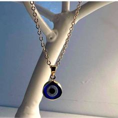 Elegant Gold Chain With A Striking Blue Evil Eye Pendant. Perfect For Any Occasion. Blue Metal Chain Jewelry, Blue Metal Jewelry With Adjustable Chain, Blue Pendant Necklace With Adjustable Chain, Blue Round Chain Necklace, Blue Round Chain Jewelry, Sterling Silver Blue Chain Jewelry, Sterling Silver Chain Jewelry In Blue, Handmade Blue Metal Necklace, Blue Metal Necklace With Evil Eye