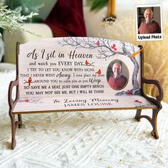 a wooden bench with a memorial photo on it