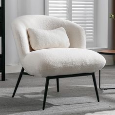 a white chair sitting on top of a carpeted floor