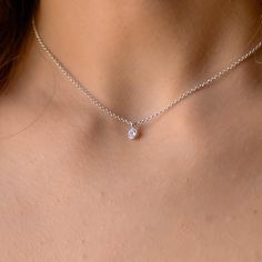 This dainty tiny Cubic Zirconia pendant necklace has a delicate chain and a minimalist style. It is so elegant and can be layered with other necklaces. The chain is solid sterling silver 925., and there is an extension so that the size can be adjusted. If you would like a custom order or have any questions please contact me, thanks. Delicate Cubic Zirconia Diamond Necklace With Clavicle Chain, Dainty Cubic Zirconia Diamond Necklace With Delicate Chain, Dainty Cubic Zirconia Birthstone Pendant Necklace, Dainty Diamond Charm Necklaces, Everyday Delicate Cubic Zirconia Charm Necklaces, Dainty Cubic Zirconia Solitaire Pendant Necklace, Delicate Solitaire Clavicle Necklace, Delicate Cubic Zirconia Charm Necklace With Adjustable Chain, Dainty Necklace With Delicate Chain And Cubic Zirconia